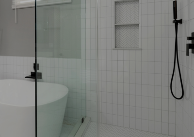 Trendy Vertical Stacked White Subway Tile Bathroom